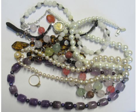 A 9ct gold ring, set with an opal, weight 1.3g, together with a collection of bead necklaces etc