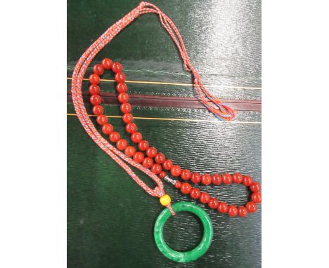 A jade ring and beads