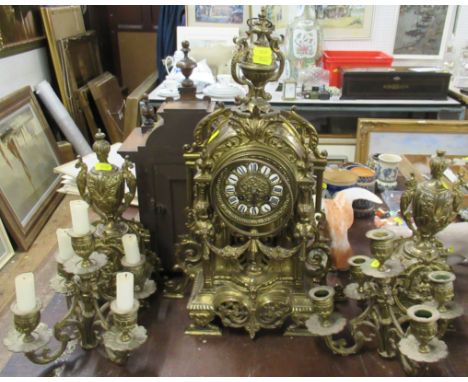 A brass clock garniture, together with a marble mantel clock, both in pieces