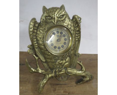 British United Clock Co. Ltd, a brass mantel clock modelled as an owl with mouse in its claws, on a branch, height 7insCondit