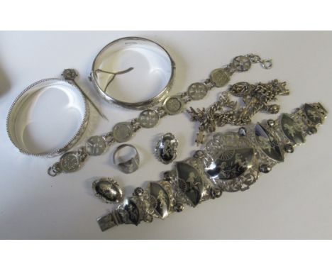 Two sterling silver bracelets, together with a three pence bracelet, stick pin and Siamese bracelet, ring, silver charm brace