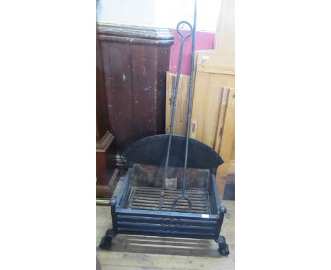 An large wrought iron fire grate with irons, width 29ins, height 25ins