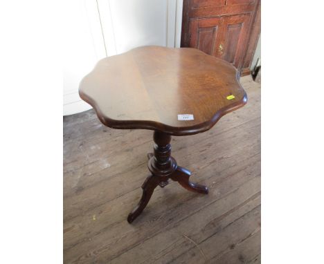 A shaped occasional table raised on a tripod base max diameter 21ins, height 27.5ins&nbsp;