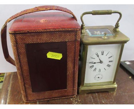 A brass cased repeating carriage clock, with subsidiary dial, together with leather covered travel case