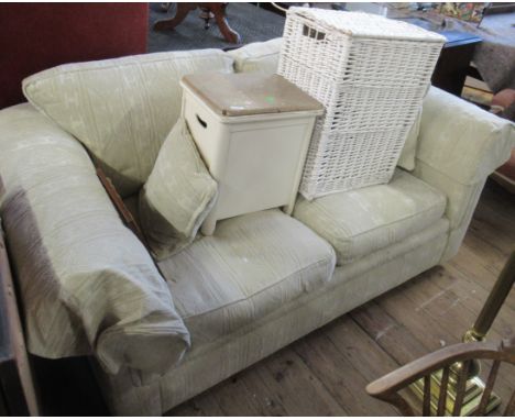A modern two seater sofa, stool with fire labels and two linen baskets&nbsp;