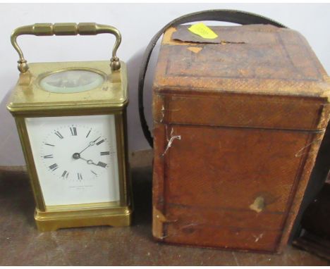 A carriage clock, the enamel dial marked Hamilton &amp; Inches Paris, together with leather covered travel case