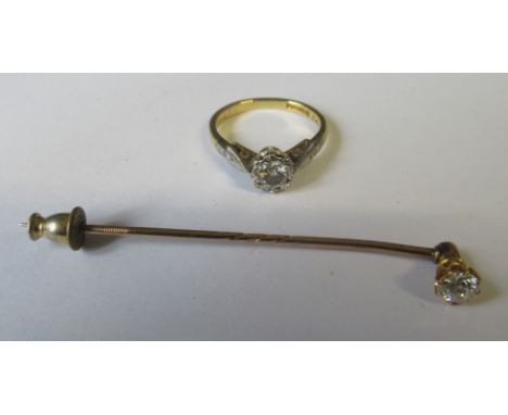 An 18ct single stone diamond ring, the round brilliant cut estimated at 0.27ct, together with a gold stick pin, set single ro