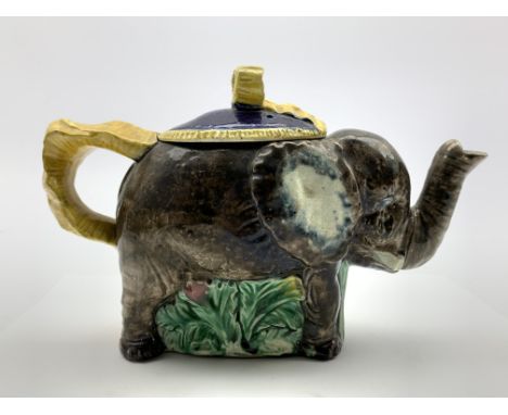 Majolica elephant tea pot, the basket weave blue lid with a yellow tied ribbon finial and handle L22cm x H13cm Condition Repo