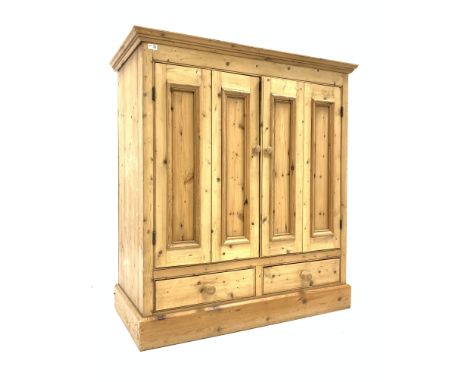 Traditional pine double bifold cupboard enclosing shelf, over two drawers to base, raised on skirted base, W120cm, H132cm, D6