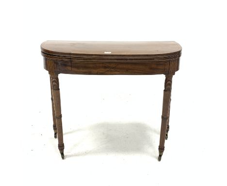 Regency mahogany demi lune card table, with inlaid ebonised stringing, fold over top revealing baize lined playing surface, r