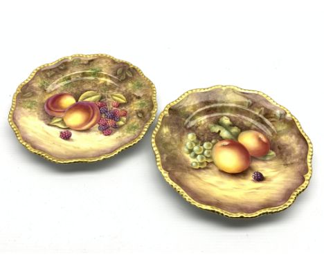 Pair of Royal Worcester cabinet plates painted with panels of fruit by R Price and S Weston with a gilded edge D20cm Conditio