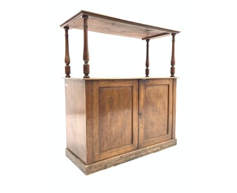 Victorian mahogany low cupboard with shelf raised on ring turned supports over two panelled doors enclosing two shelves, W111