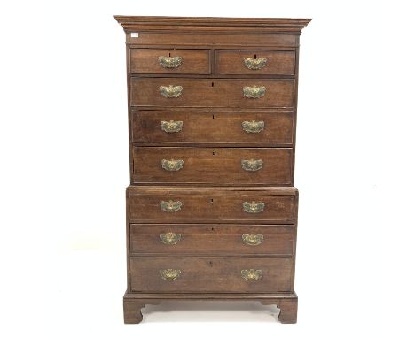 George III oak tall boy chest on chest, the top section having moulded projecting cornice over two short and three long gradu