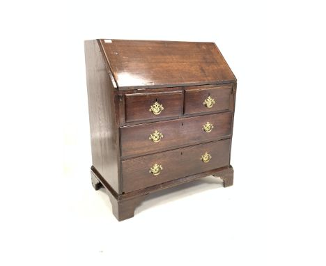 Early 19th century oak bureau, fall front revealing fitted interior, over two short and two long drawers, raised on shaped br