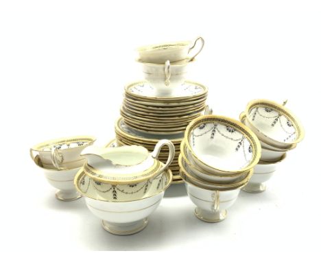 Shelley tea set decorated with garlands within a key pattern border comprising twelve cups and saucers, twelve plates, two br