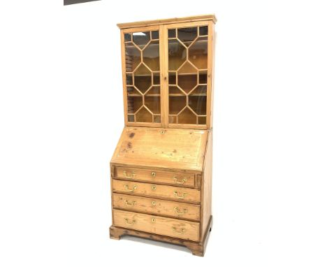 Georgian pine bureau bookcase, astragal glazed doors enclosing three adjustable shelves, fall front under revealing fitted in