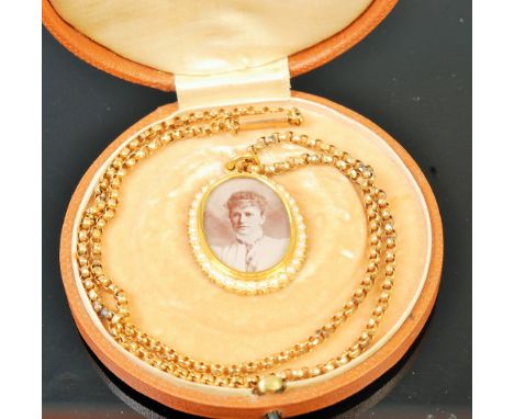 A circa 1900 18ct gold cased picture locket having seed pearl set surround and on 15ct gold belcher link neck chain, locket h