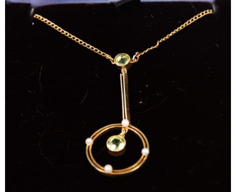 A 15ct gold green peridot and seed pearl set pendant on finelink neck chain    Condition Report / Extra Information  Gross we