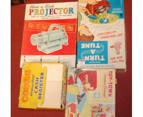 A boxed childs Show and Slide projector; together with various boxed childrens toys to include; Kodeg cash register, ToyTown 