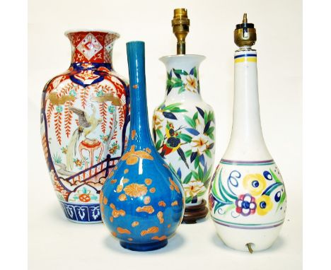 An early 20th century bottle vase in the Chinese style, on a blue ground with applied floral decoration, h.29cm; together wit