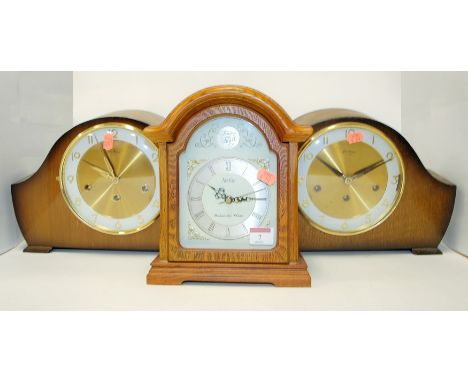 A 1940s Bentina oak cased mantel clock, having enamelled dial with Arabic numerals and eight day movement; together with anot