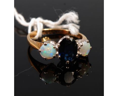 An 18ct gold synthetic sapphire and opal set dress ring, size M