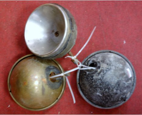 An early 20th century brass cased motor car headlamp; together with two other similar (3)