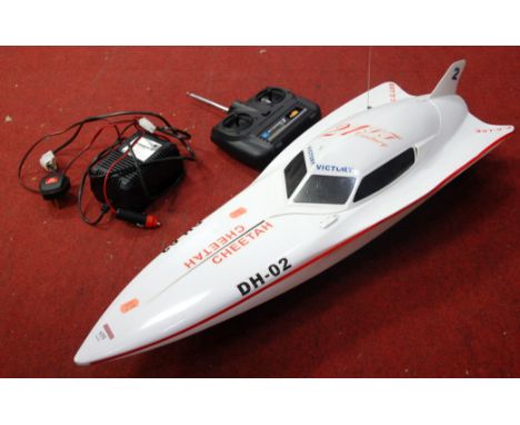 A battery operated remote controlled plastic model of a speedboat