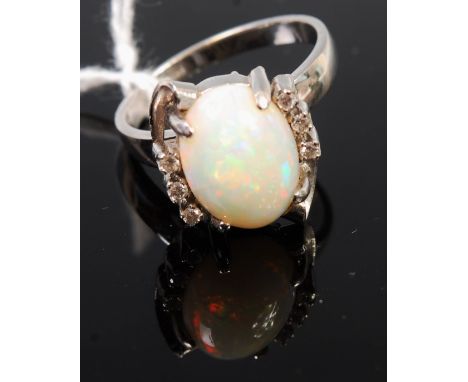 A 14ct white  gold opal and diamond point set dress ring, size R