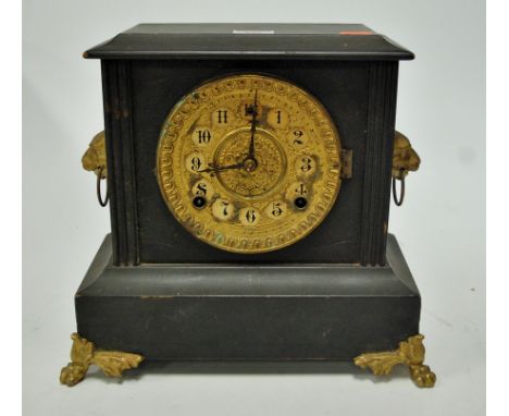 A late 19th century faux marble cased mantel clock, having gilt brass dial with Arabic numerals and eight day movement, flank