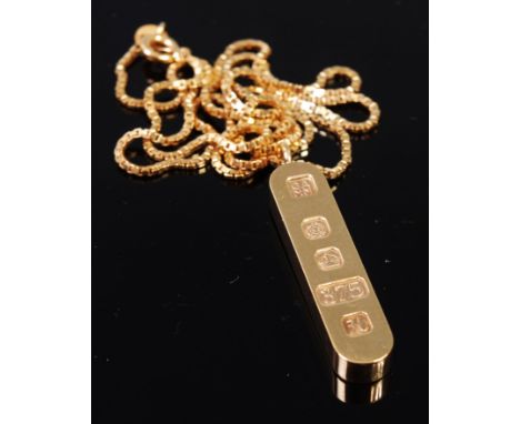 A modern 9ct gold pendant as a gold ingot on box link neck chain , gross weight 16.9g