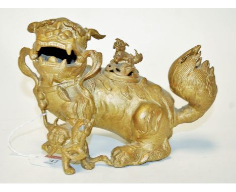 An early 20th century cast metal and later gilded model of a dog of Fo, h.14cm