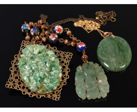 A modern Chinese jade pendant finely engraved and on 14ct finelink neck chain, together with one other jade pendant on beaded