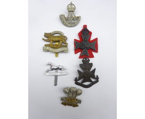 Six cap badges including Durham Light Infantry, 12th London Rangers, Leicestershire Regiment, 15th/16th London Westminsters (