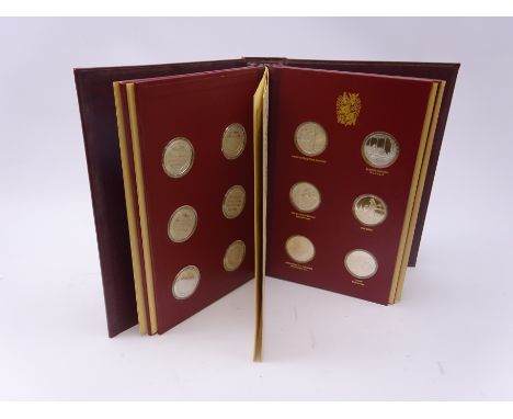 Collection of twenty-four sterling silver hallmarked medals by John Pinches, in original presentation folder Condition Report