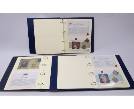 Sixteen coin covers each containing a modern commemorative coin, some being five pounds, in two ring binder folders and a rin