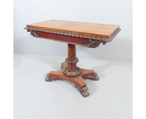A 19th century rosewood fold-over card table, on turned central column with platform base. 93x74x46cm. 