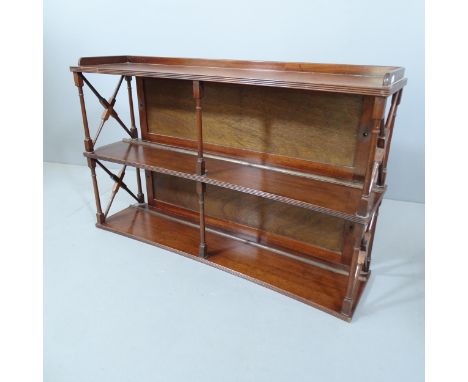 A 19th century mahogany concave fronted hanging shelf. 92x57x23cm. 