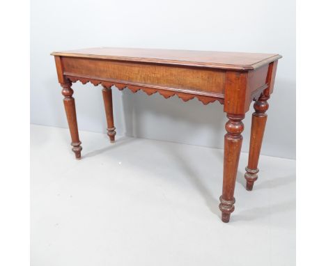 A Victorian mahogany console table, with end frieze drawer and raised on turned legs. 122x72x42cm.