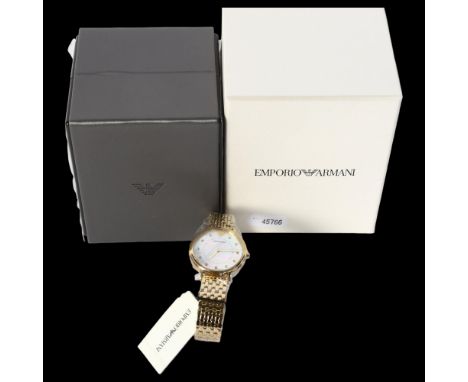 EMPORIO ARMANI - a lady's gold plated quartz wristwatch with a mother-of-pearl dial, unused and boxed 