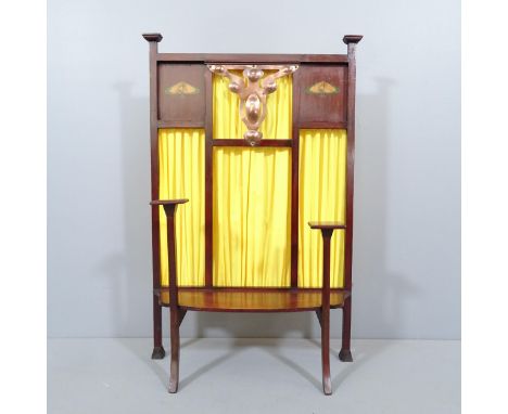 An Arts and Crafts mahogany fire screen with copper mount and painted decoration. Believed to have been retailed by Liberty's