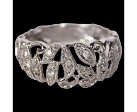 A delicate 9ct white gold and diamond set dress ring, with openwork decoration, size R 