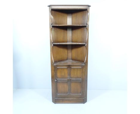 An mid-century elm Ercol 'Golden Dawn' corner cupboard, with maker's label. 71x184x50cm. 