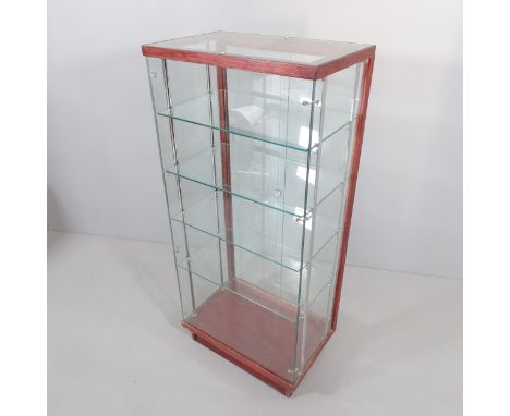 An oak and glass shop display case with four shelves and rear sliding doors. 62x138x40cm. Shelf 57x34cm. 