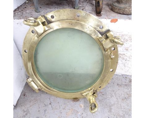 A polished bronze porthole, impressed W L Halley of Dumbarton. Diameter 59cm. 
