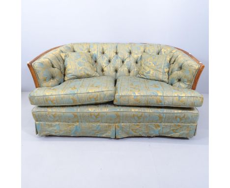 An Edwardian style scoop back two-seater sofa, with button back upholstered and mahogany show wood. Overall 145x73x88cm, seat