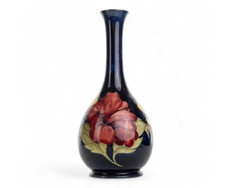 MOORCROFT VASE, hibiscus pattern, of oviform with cylindrical neck, with tube lined floral decoration in shades of pink, purp