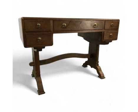 WALNUT WRITING DESK, IN THE MANNER OF ARTHUR ROMNEY GREEN, CONTEMPORARY fitted with one long drawer flanked on each side by t