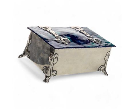 ARTS & CRAFTS SILVER CASKET, of rectangular form, the hinged lid decorated in green and blue enamels, raised on pad feet16.5c