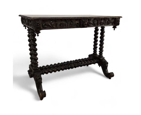 VICTORIAN STAINED OAK DESK, with carved frieze with two drawers on barley twist supports on carved feetAdditional images now 